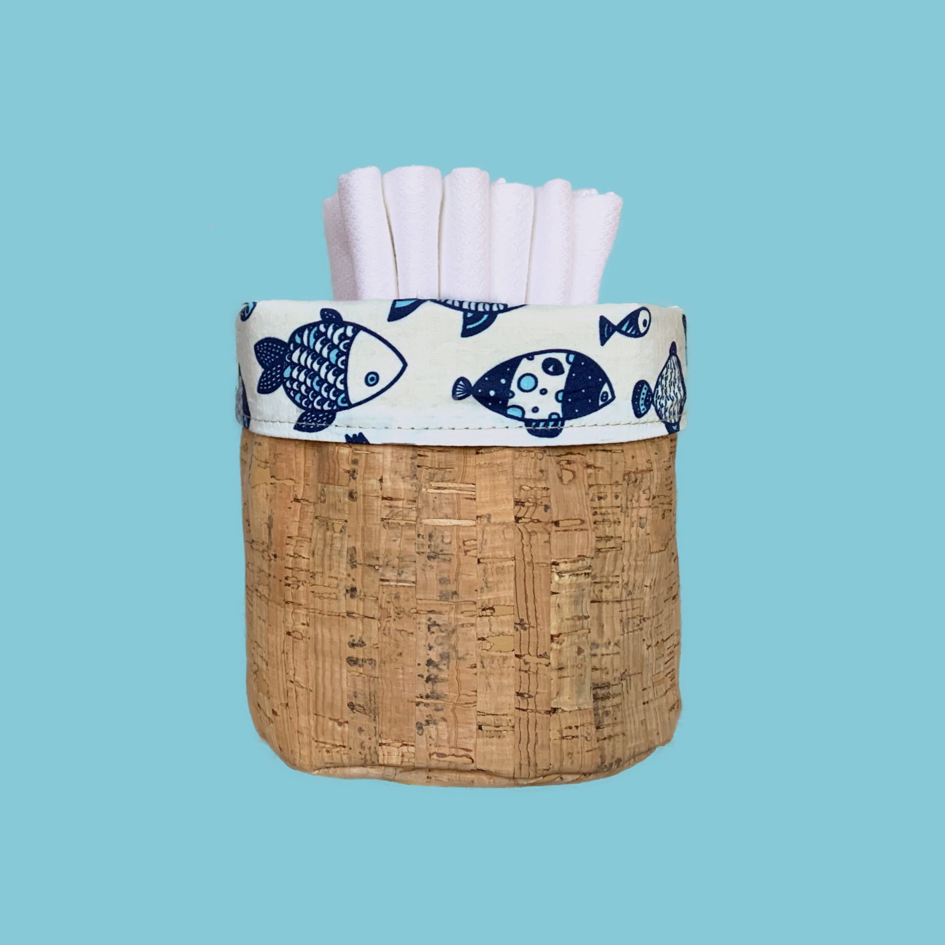 Handecloth Reversible Cork Basket with Nautical Blue and White Fish Fabric  that has 6 Reusable Paper Towels Inside