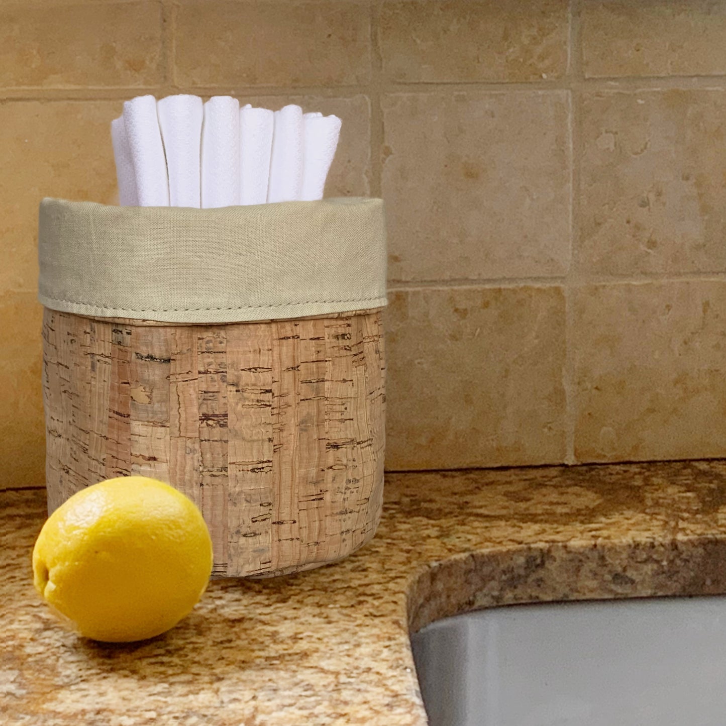 Handecloth Reversible Cork Fabric Basket sitting next to a sink