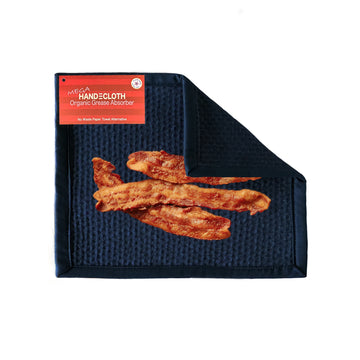 Black hand towel with organic grease absorber label and bacon illustration on a white background